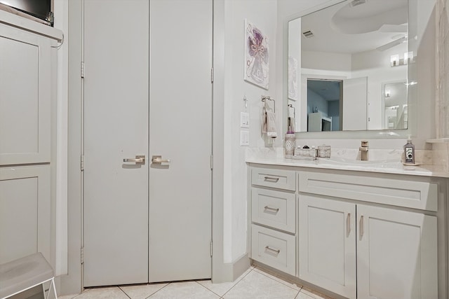 bathroom with tile patterned floors and vanity