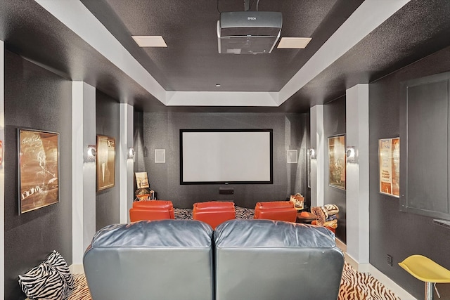 home theater room featuring a tray ceiling