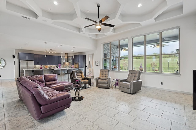 living room featuring coffered ceiling