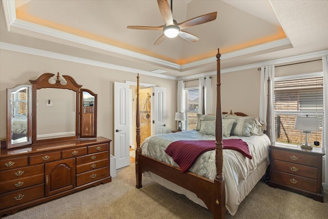 bedroom with ornamental molding, a raised ceiling, light colored carpet, and ceiling fan