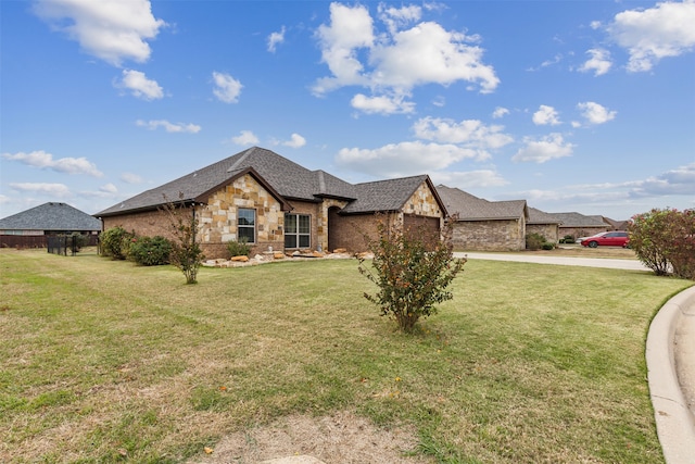 french provincial home featuring a front yard