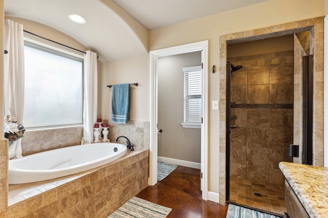 bathroom featuring vanity and plus walk in shower