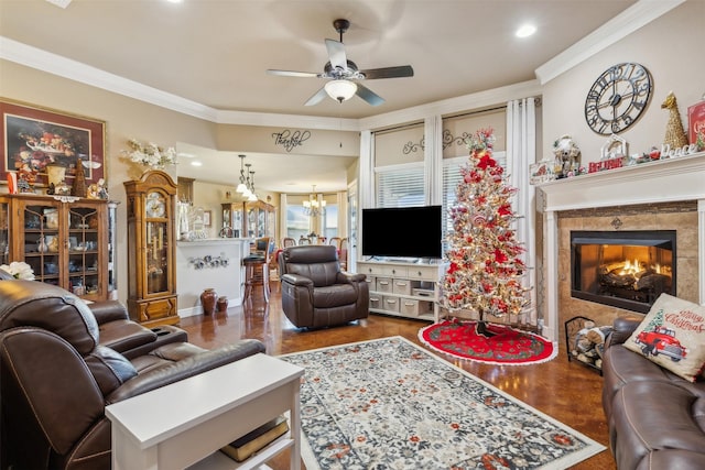 living room featuring ceiling fan with notable chandelier, dark hardwood / wood-style floors, and ornamental molding