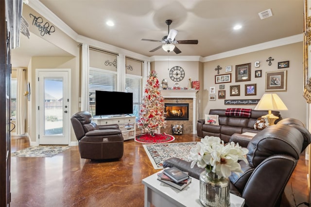 living room with concrete floors, ceiling fan, and ornamental molding