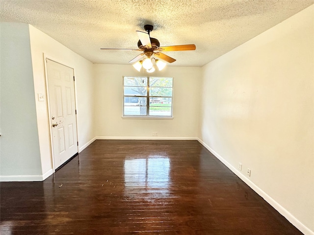 unfurnished room featuring ceiling fan, dark wood-type flooring, and a textured ceiling