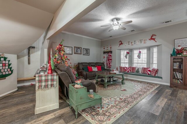 living room featuring a textured ceiling, dark hardwood / wood-style floors, ceiling fan, and crown molding