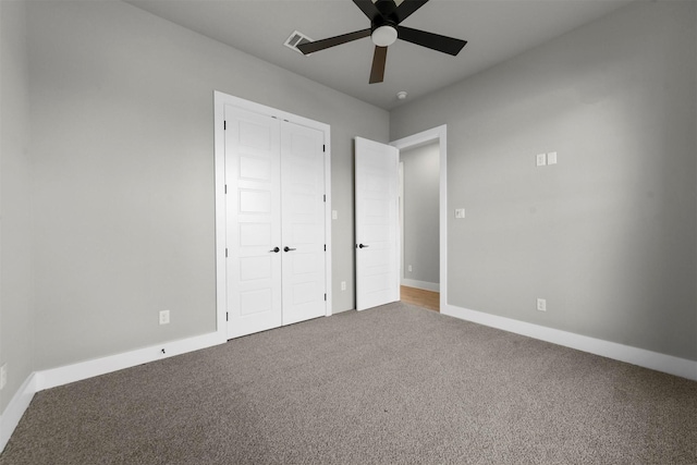 unfurnished bedroom featuring carpet and ceiling fan