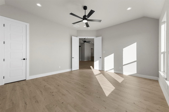 unfurnished bedroom with ceiling fan and light hardwood / wood-style flooring