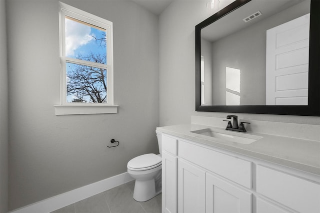 bathroom with tile patterned floors, vanity, and toilet