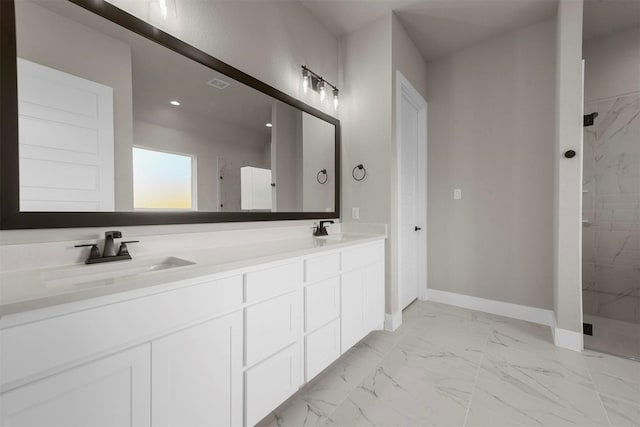 bathroom featuring vanity and a shower with shower door