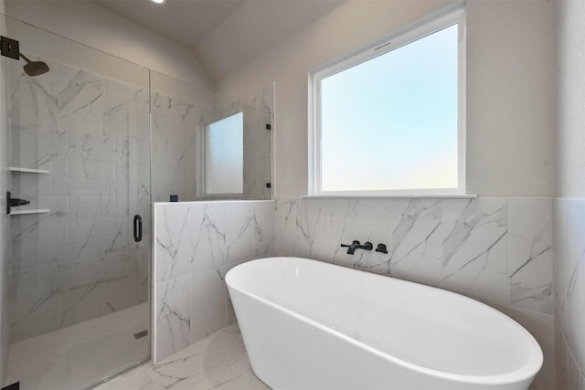 bathroom featuring shower with separate bathtub and lofted ceiling