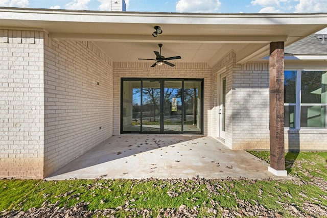 property entrance with ceiling fan and a patio