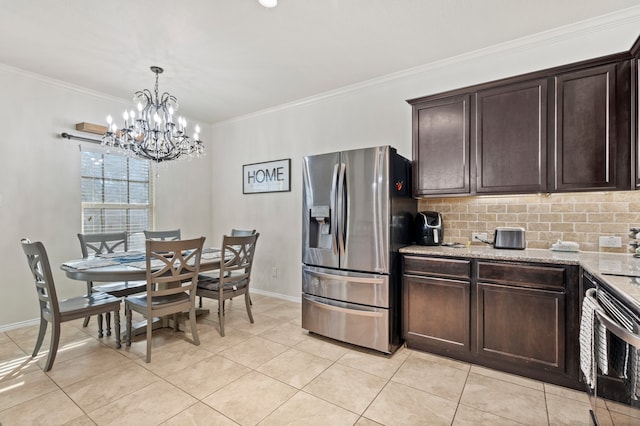 kitchen featuring decorative backsplash, stainless steel refrigerator with ice dispenser, dark brown cabinetry, and an inviting chandelier