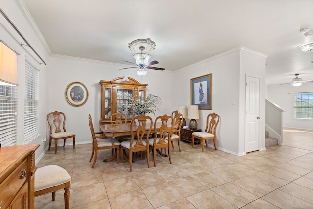 tiled dining area with ceiling fan and crown molding