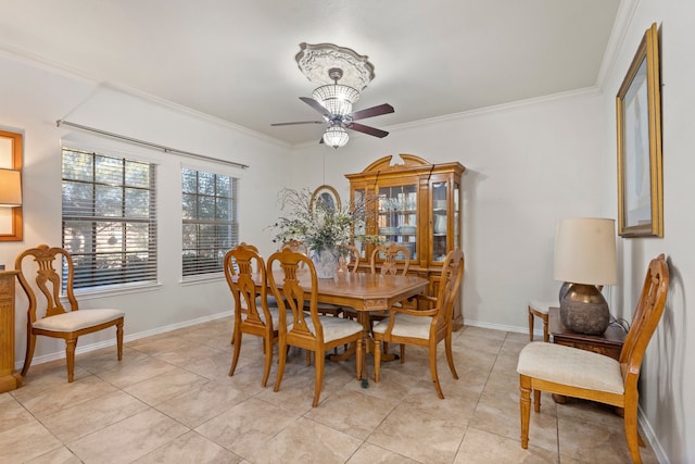 dining space featuring ceiling fan, light tile patterned floors, and crown molding