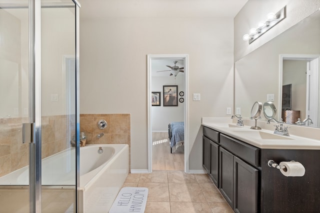 bathroom featuring tile patterned floors, vanity, ceiling fan, and shower with separate bathtub