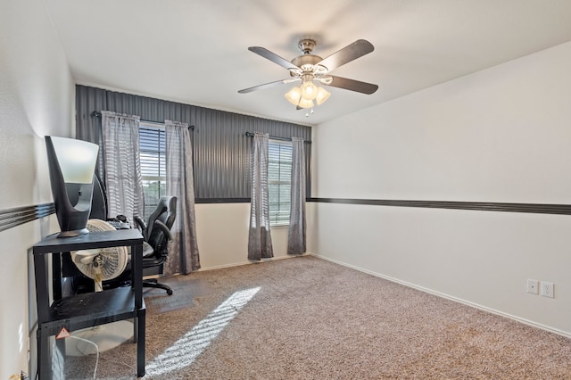 office area with carpet floors and ceiling fan