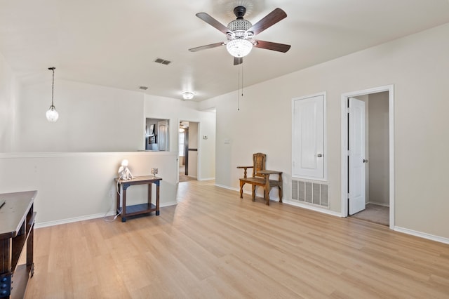 interior space with ceiling fan and light hardwood / wood-style floors