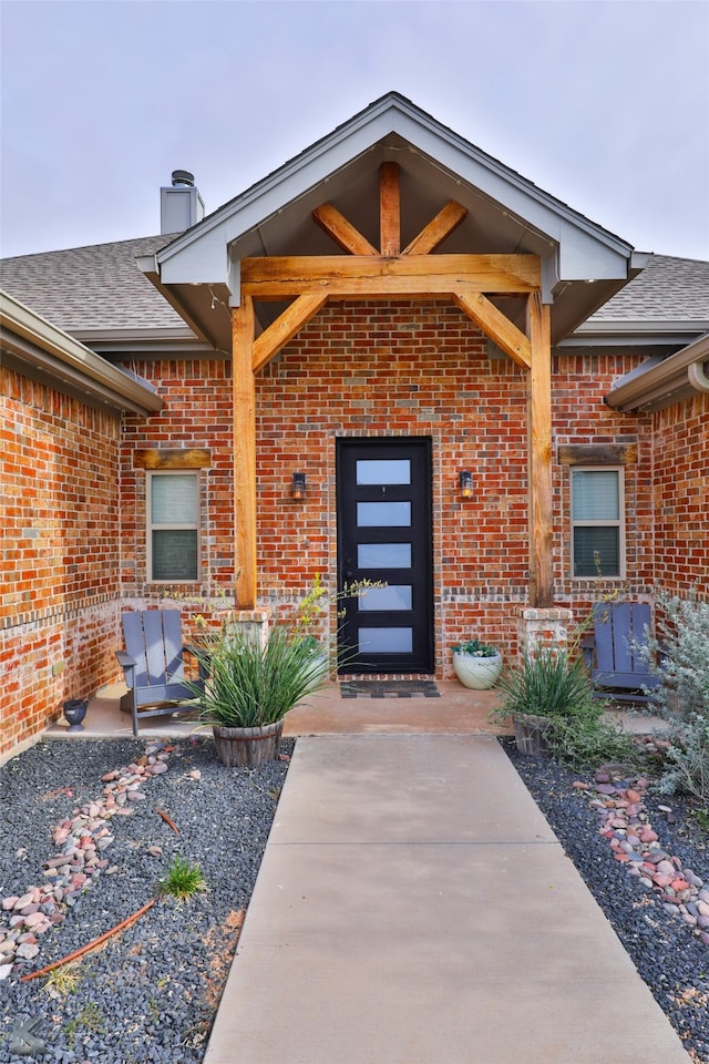 property entrance featuring a patio