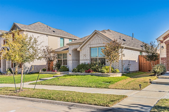 view of front of home with a front lawn