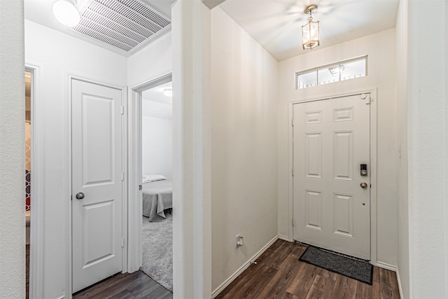 foyer with dark wood-type flooring