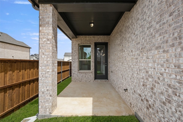 1536 Euclid Aly, Corinth, TX 76208 - doorway to property featuring fence and a patio