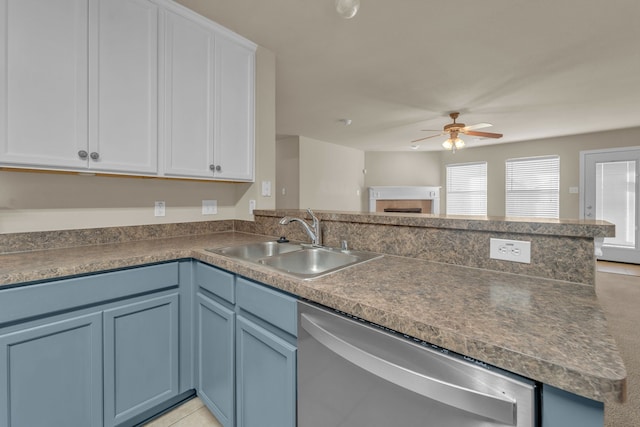 kitchen with ceiling fan, dishwasher, sink, kitchen peninsula, and white cabinets