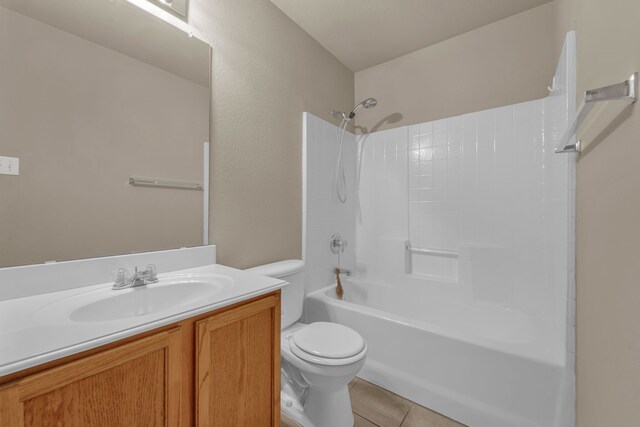 full bathroom with tile patterned flooring, vanity, toilet, and washtub / shower combination