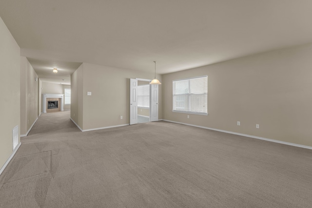 unfurnished room with light colored carpet