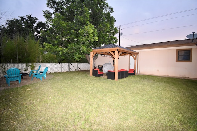 view of yard featuring an outdoor living space and a gazebo