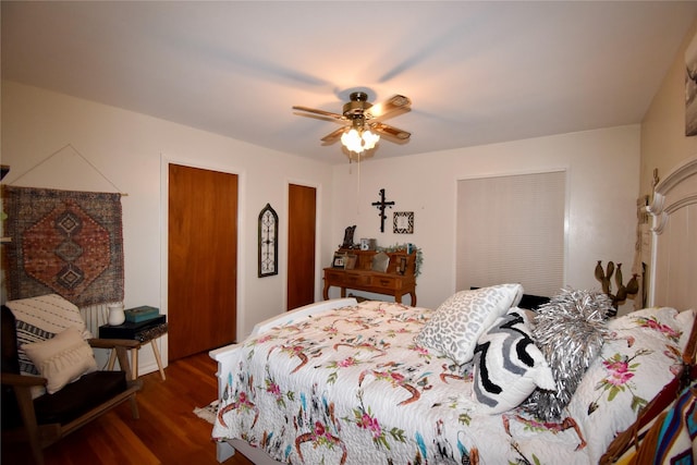 bedroom featuring dark wood-type flooring and ceiling fan