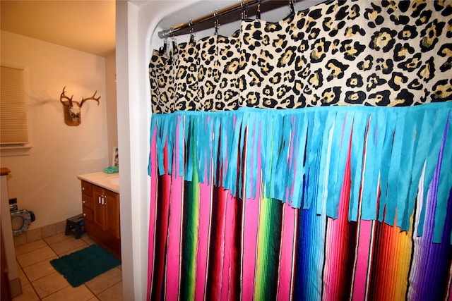 bathroom with tile patterned floors and vanity