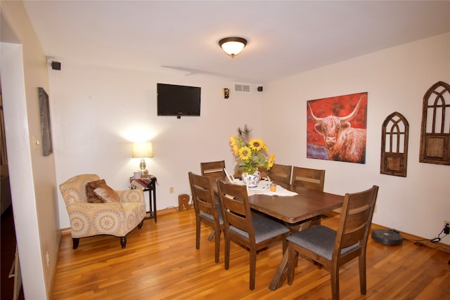 dining area featuring light wood-type flooring