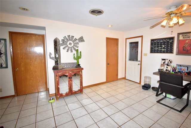 tiled foyer entrance featuring ceiling fan