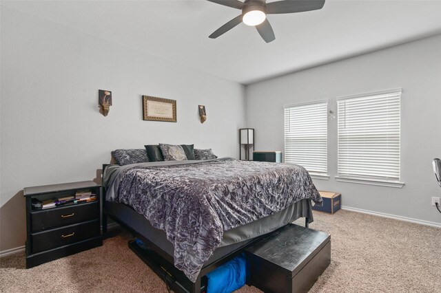 bedroom with ceiling fan and carpet