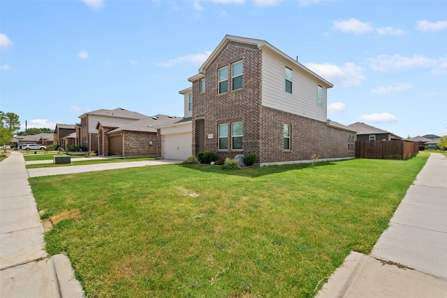 view of side of home with a yard and a garage