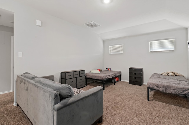 carpeted bedroom featuring multiple windows