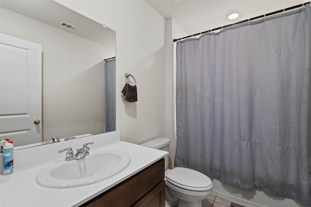 full bathroom featuring tile patterned floors, vanity, toilet, and shower / tub combo with curtain