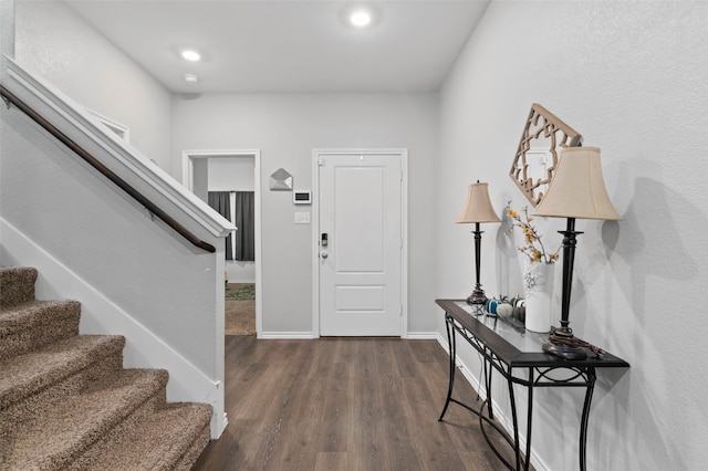 foyer with dark hardwood / wood-style floors