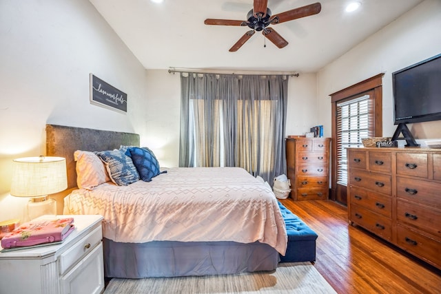 bedroom with light wood-type flooring, ceiling fan, and recessed lighting