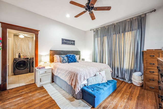 bedroom featuring ceiling fan, wood finished floors, and washing machine and clothes dryer