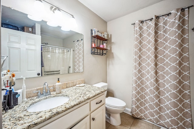 bathroom with curtained shower, vanity, toilet, and tile patterned floors