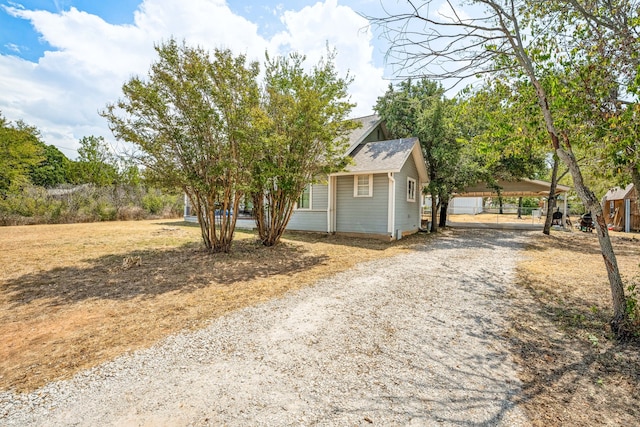 exterior space featuring gravel driveway