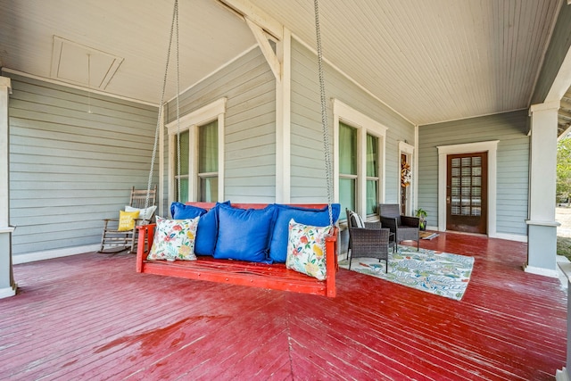 wooden deck featuring covered porch