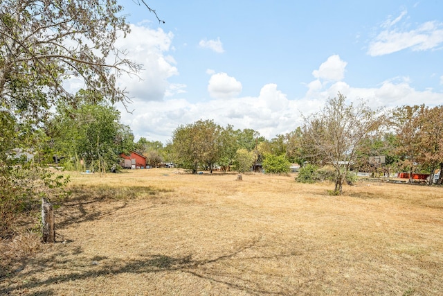 view of yard with a rural view