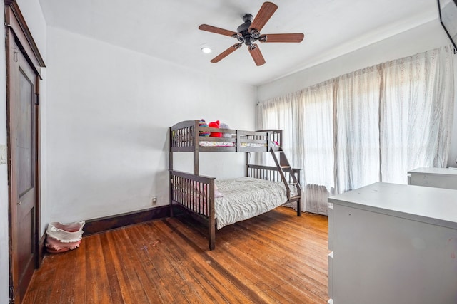 632 E Labadie Ave, De Leon, TX 76444 - bedroom featuring wood finished floors and ceiling fan