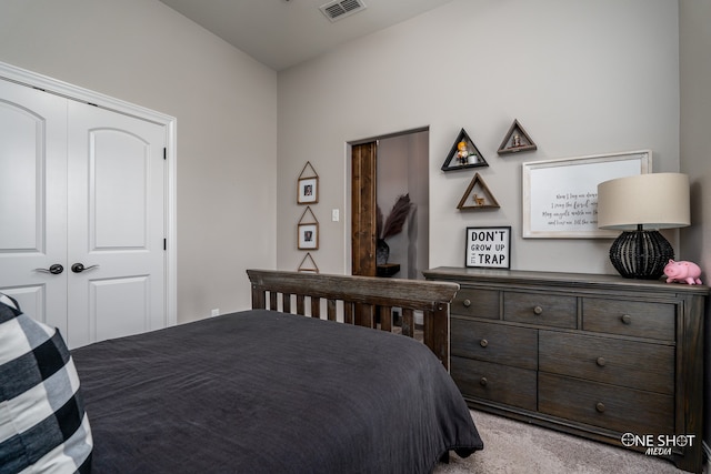 carpeted bedroom with a closet