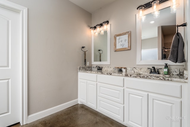 bathroom with concrete flooring and vanity