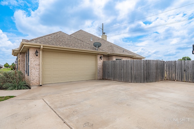 view of side of property featuring a garage