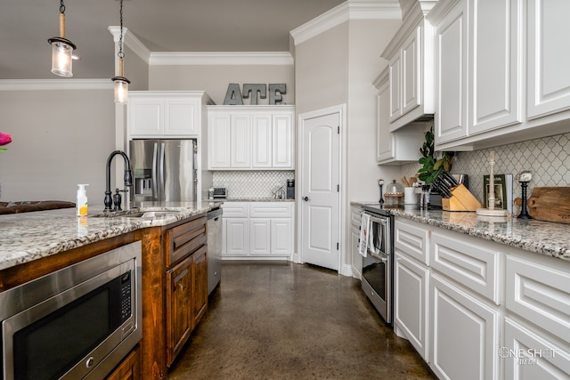 kitchen with sink, white cabinetry, stainless steel appliances, and ornamental molding